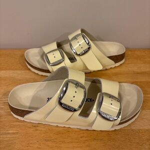Birkenstock Cream Sandals with Silver Buckles